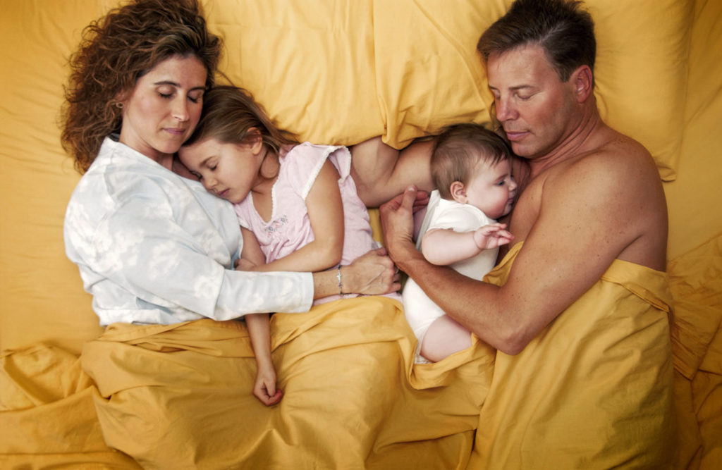 family-sleeping-2-kids